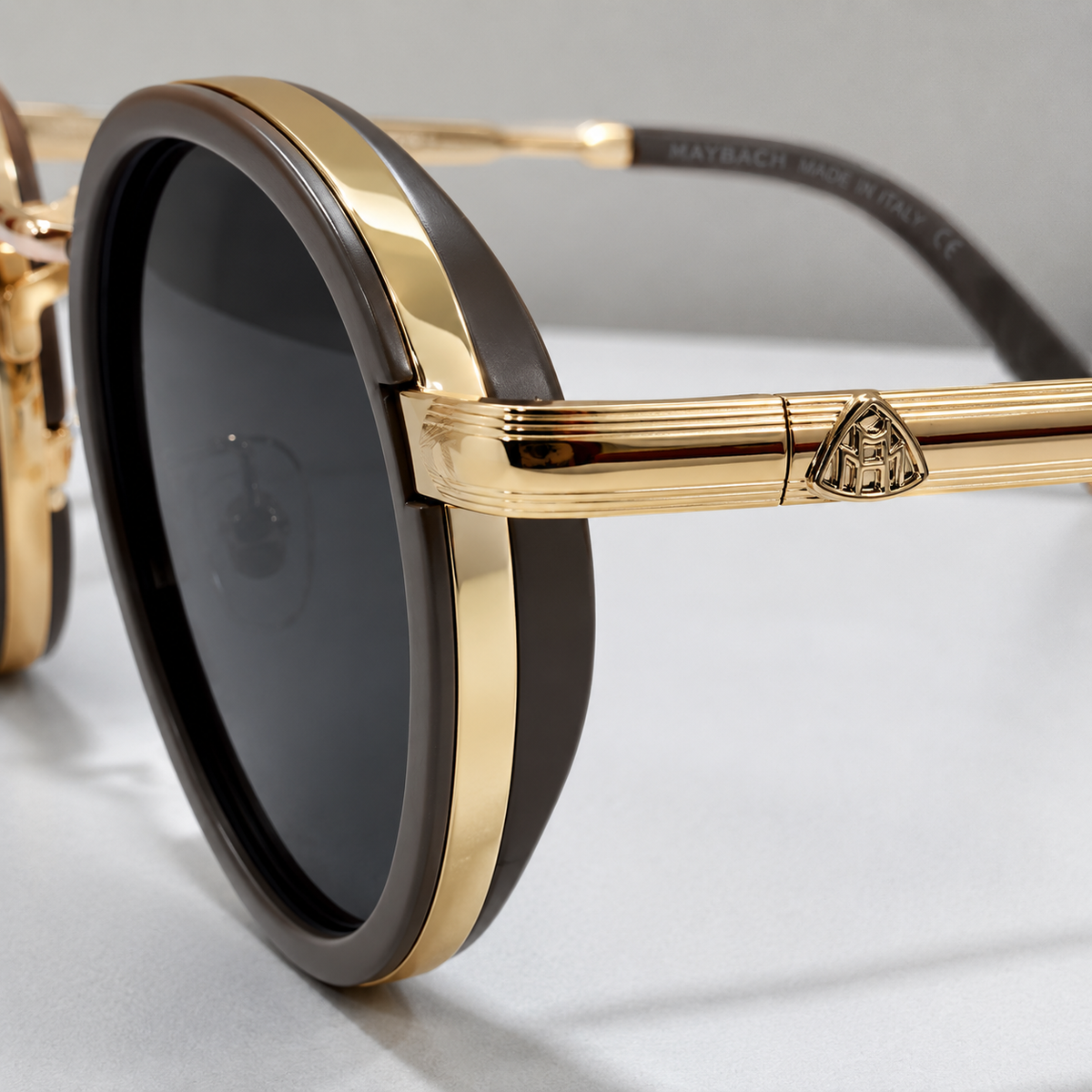 Maybach round sunglasses - close-up of sculpted Maybach crest hinge and gold fluted temple detail