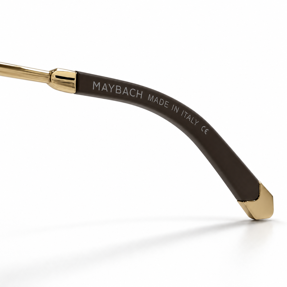Maybach Made in Italy CE inscription on dark brown acetate temple tip with gold end cap